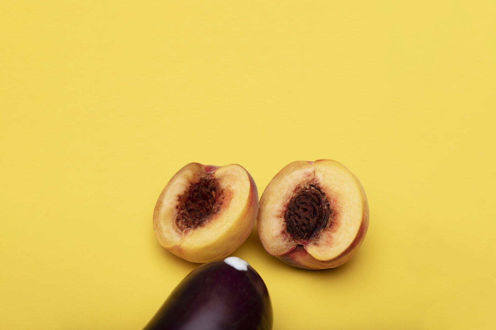 Sliced Peach on Yellow Surface